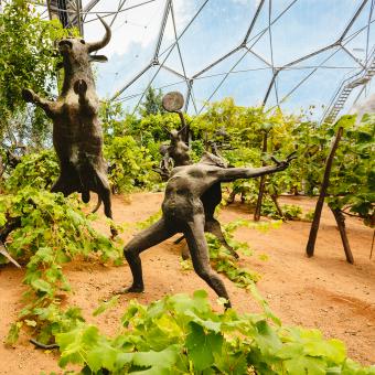 Grape vines cultivated in Eden's Mediterranean Biome surrounding sculpture